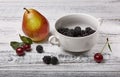 fresh pears with berries on a wooden table Royalty Free Stock Photo