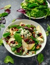 Fresh Pears, Blue Cheese salad with vegetable green mix, walnuts, cranberry. healthy food Royalty Free Stock Photo