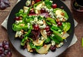 Fresh Pears, Blue Cheese salad with vegetable green mix, Walnuts, red grapes. healthy food Royalty Free Stock Photo