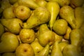 Fresh pears spread out evenly as a background.