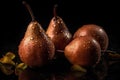 Fresh pears with water drops isolated on a dark background.