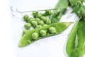 Fresh peas in a pea pod on white background, close up, isolated Royalty Free Stock Photo