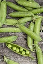 Fresh peas on wood Royalty Free Stock Photo