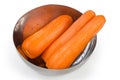 Fresh peeled carrots in stainless steel bowl on white background Royalty Free Stock Photo