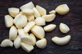 Fresh Peeled Garlic Cloves on old wooden background Royalty Free Stock Photo