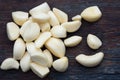 Fresh Peeled Garlic Cloves on old wooden background Royalty Free Stock Photo