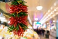 Fresh peppers hanging at market Royalty Free Stock Photo