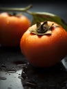 Fresh persimmon fruit with water drops on black background, selective focus