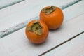 Fresh persimmon on a wooden background fruit