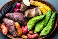 Fresh peruvian Latin American vegetables caigua, sweet potatoes, black corn, camote, yuca