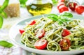 Fresh Pesto Pasta Topped With Cherry Tomatoes and Parmesan on a Bright Day Royalty Free Stock Photo