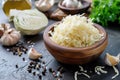 Fresh pickled sauerkraut cabbage with ingredients in bowl