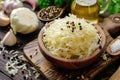 Fresh pickled sauerkraut cabbage with ingredients in bowl