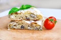 Fresh piece of savory strudel stuffed with chicken meat and mushrooms s