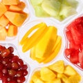 Fresh pieces of fruits in plastic container.