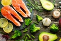 Fresh pieces of salmon steak, trout, salmon, pink salmon. With ingredients vegetables, avocado, rosemary and broccoli. Healthy and Royalty Free Stock Photo