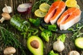 Fresh pieces of salmon steak, trout, salmon, pink salmon. With ingredients vegetables, avocado, rosemary and broccoli. Healthy and Royalty Free Stock Photo