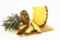 Fresh Pineapple Being Cut On A Wooden Board