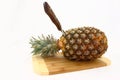Fresh Pineapple On Cutting Board With Knife Royalty Free Stock Photo