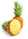 Fresh pineapple fruit with cut and green leaves Royalty Free Stock Photo