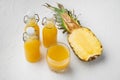 Fresh pineapple juice, on white stone table background Royalty Free Stock Photo