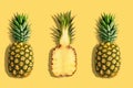 Fresh pineapples on yellow background. Creative suumer concept