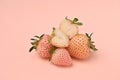 fresh pineberry berries cut close-up on pink background Royalty Free Stock Photo