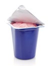 Fresh pink berry yogurt in blue plastic pot