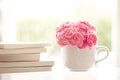 fresh pink carnation flower with books background Royalty Free Stock Photo