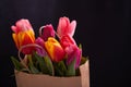 Fresh pink tulip flowers in paper bag. Royalty Free Stock Photo