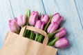 Fresh pink tulip flowers in paper bag Royalty Free Stock Photo