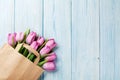 Fresh pink tulip flowers in paper bag Royalty Free Stock Photo