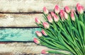 Fresh pink tulips water drops wooden background Royalty Free Stock Photo