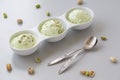 Fresh pistachio ice cream, nuts and mint. Royalty Free Stock Photo