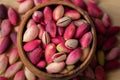 Fresh pistachios in a bowl, unpeeled