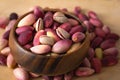 Fresh pistachios in a bowl, unpeeled