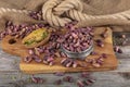 Fresh pistachios in copper bowl on wooden rustic background, wonderful peanut composition for healthy and dietary nutrition.