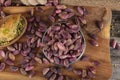 Fresh pistachios in copper bowl on wooden rustic background, wonderful peanut composition for healthy and dietary nutrition.