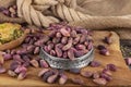 Fresh pistachios in copper bowl on wooden rustic background, wonderful peanut composition for healthy and dietary nutrition.