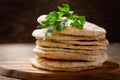 Fresh pita bread on a wooden background