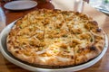 Fresh pizza with chicken and garlic sauce