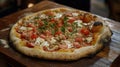 A fresh pizza on a rustic table with toppings, marking National Pizza Royalty Free Stock Photo