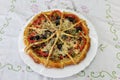 Fresh pizza with tomatoes, cheese and olive on wooden table closeup Royalty Free Stock Photo