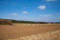 Fresh plowed farmland in march under a blue sky