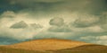 Fresh plowed field with blue sky and clouds