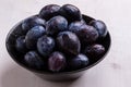 Fresh plums in black bowl Royalty Free Stock Photo