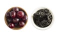 Fresh plums and dried prunes isolated on a white background. Dried prunes and fresh plums in a bowl on white background. Dried pru Royalty Free Stock Photo