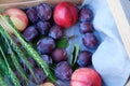 Fresh plums and peaches in a wooden box Royalty Free Stock Photo