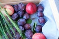 Fresh plums and peaches in a wooden box Royalty Free Stock Photo