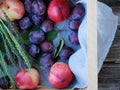 Fresh plums and peaches in a wooden box Royalty Free Stock Photo